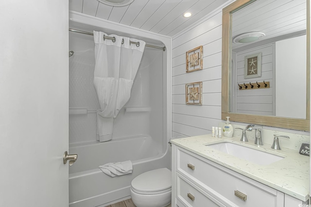 full bathroom featuring toilet, shower / bath combo, wooden walls, wooden ceiling, and vanity