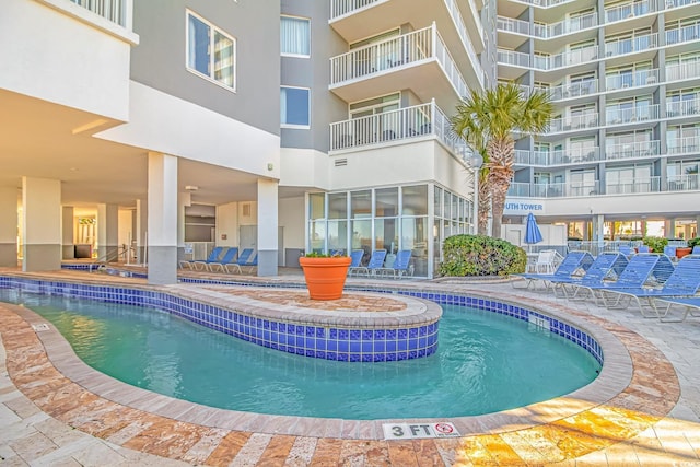 community pool featuring a patio area