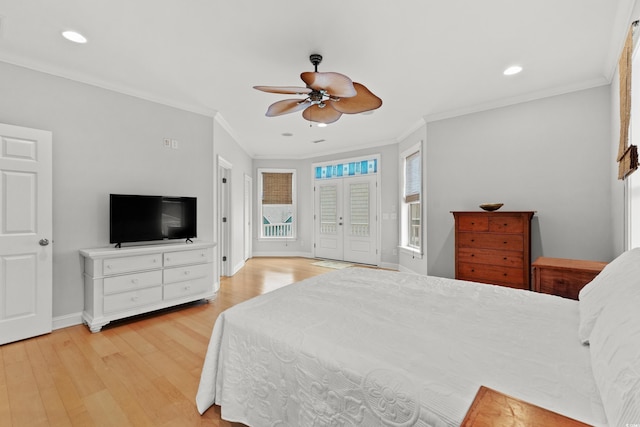 bedroom with light wood-type flooring, french doors, ceiling fan, and crown molding