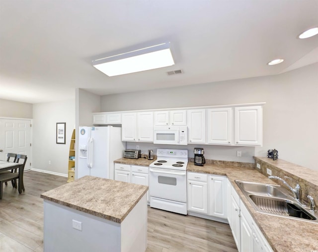 kitchen featuring sink, white appliances, white cabinets, and light hardwood / wood-style flooring