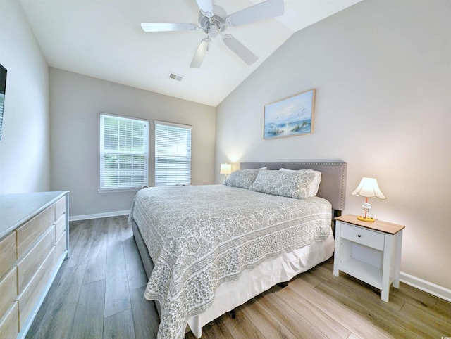 bedroom with vaulted ceiling, light wood-type flooring, and ceiling fan