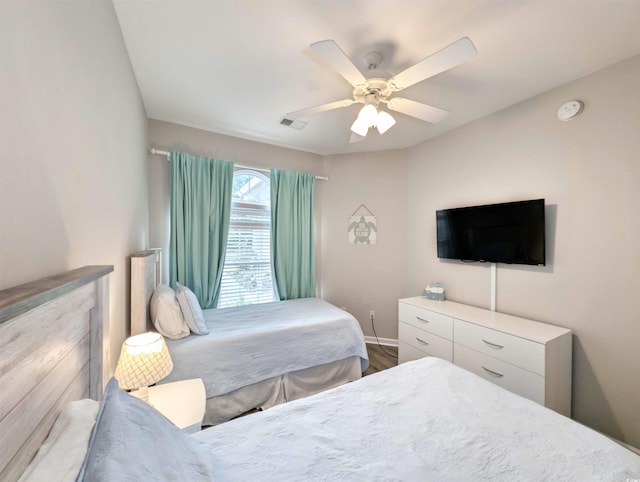 bedroom featuring hardwood / wood-style flooring and ceiling fan