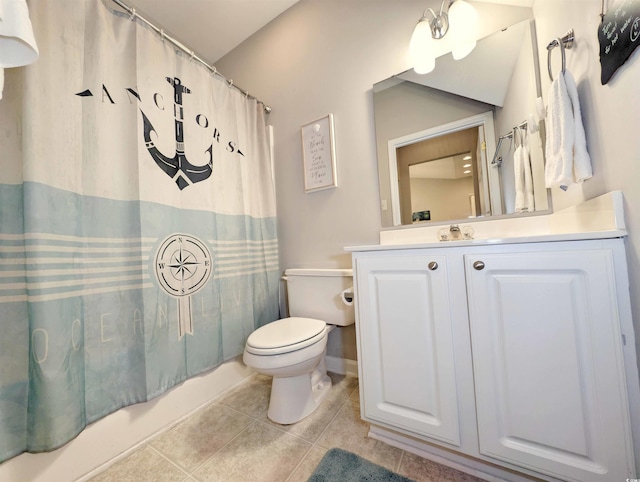 full bathroom featuring toilet, shower / bath combo with shower curtain, tile patterned floors, and vanity