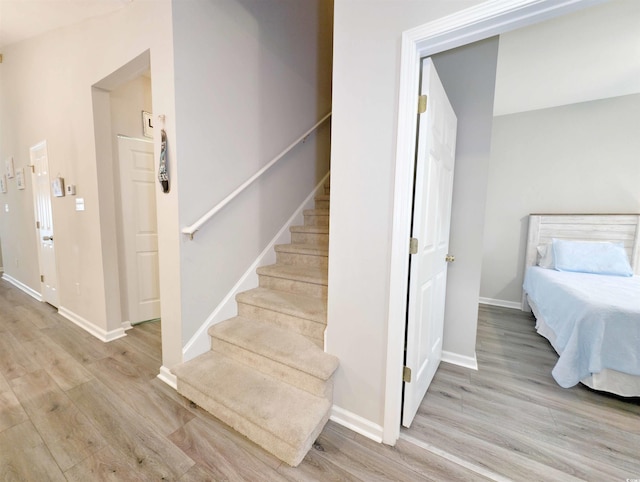 staircase featuring hardwood / wood-style flooring