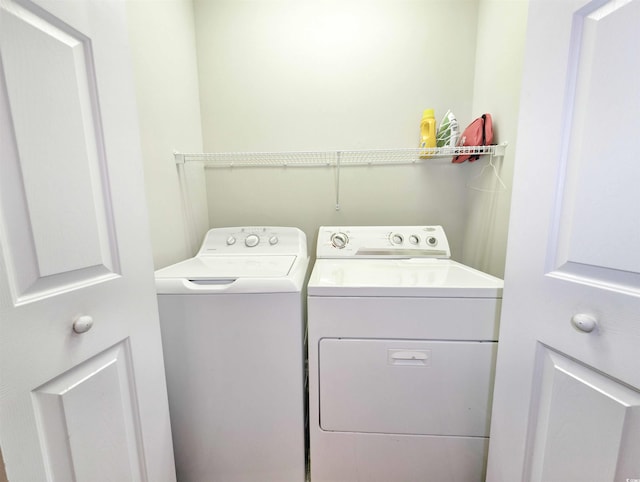 washroom with washer and clothes dryer