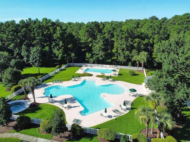 view of swimming pool with a yard and a patio