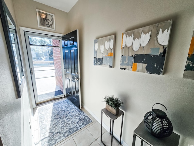 entrance foyer featuring light tile patterned floors