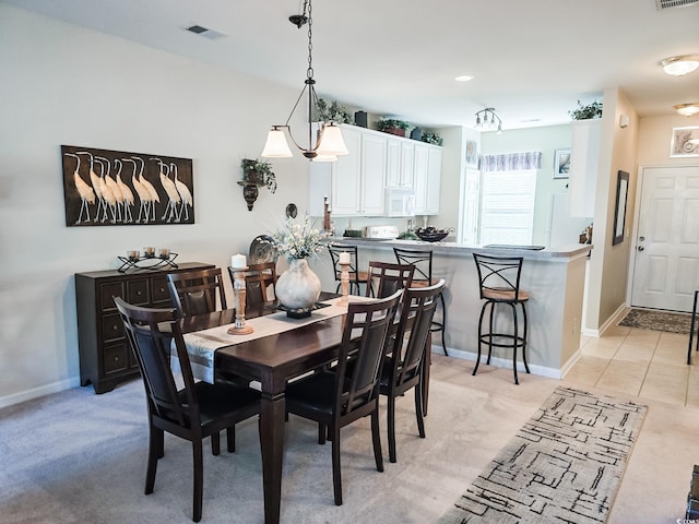 dining space with light carpet