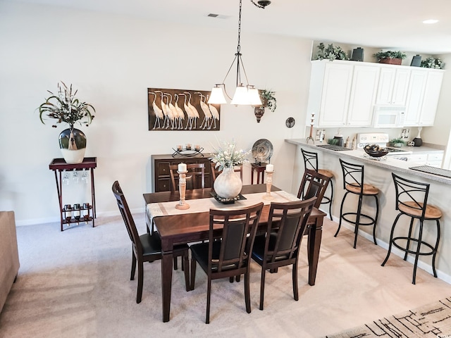 dining area with light carpet