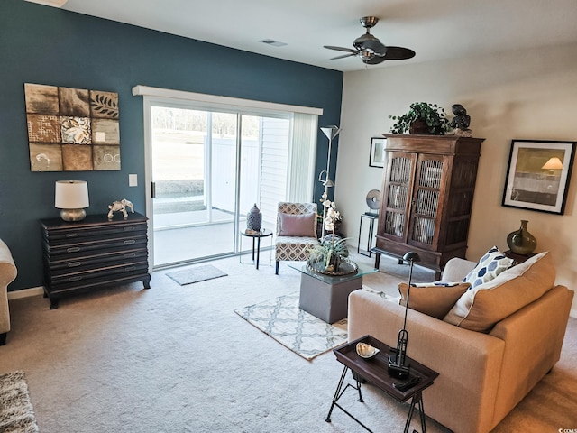 carpeted living room featuring ceiling fan