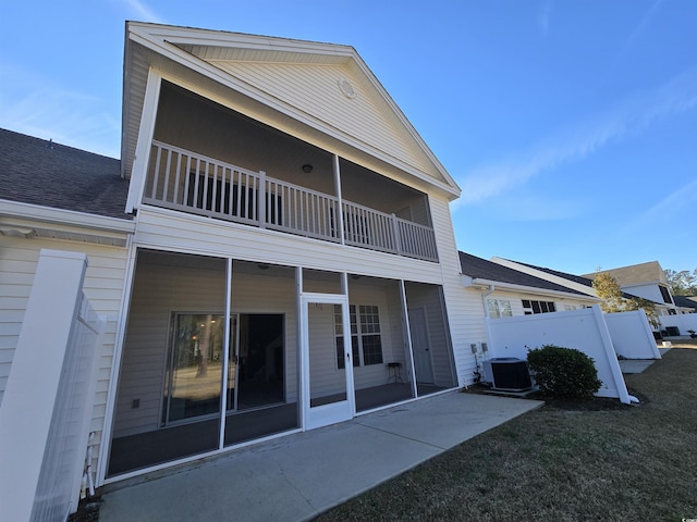 back of house with central AC and a patio