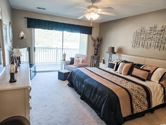 carpeted bedroom featuring access to exterior and ceiling fan