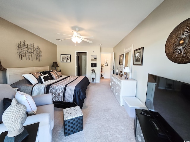 bedroom featuring ceiling fan and light carpet