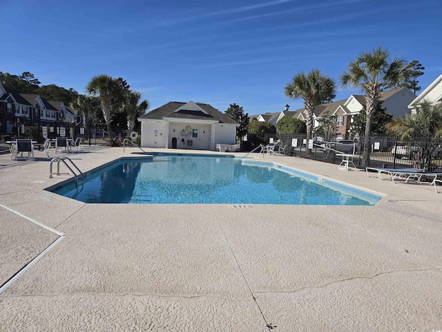 view of swimming pool with a patio area