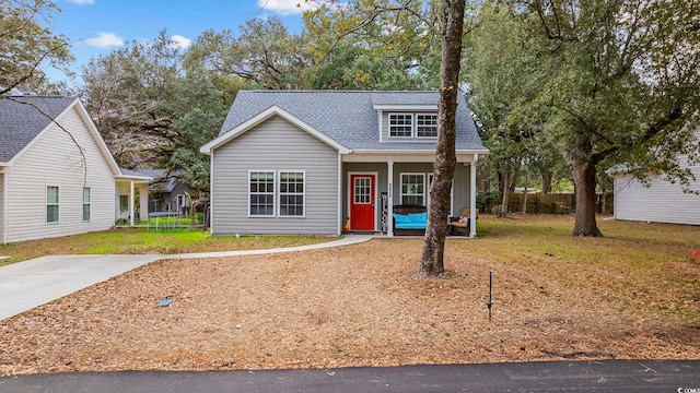 view of front facade with a porch and a front yard