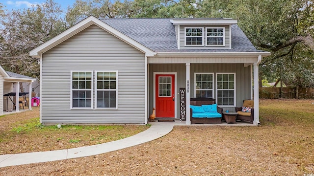 view of front facade with a porch and a front lawn