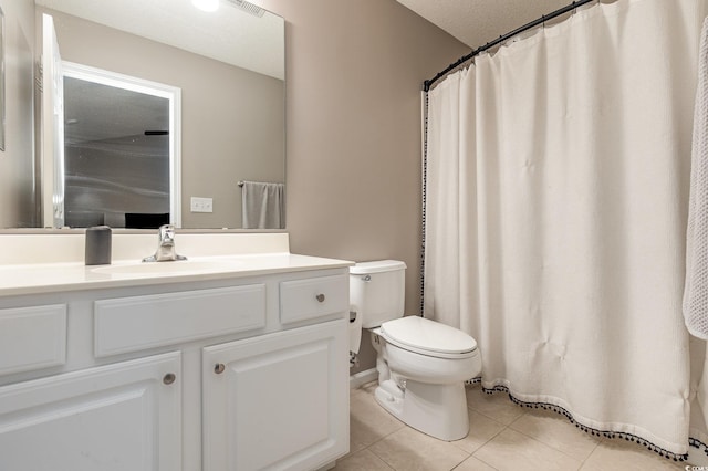 629 Riverward Dr Unit 629, Myrtle Beach, SC 29588 - bathroom with tile patterned floors, toilet, vanity, and a textured ceiling