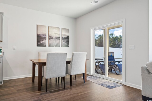 dining area with dark wood-type flooring