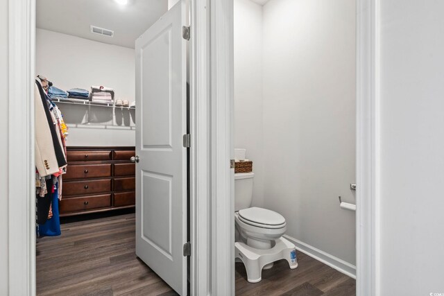 bathroom featuring toilet and hardwood / wood-style flooring