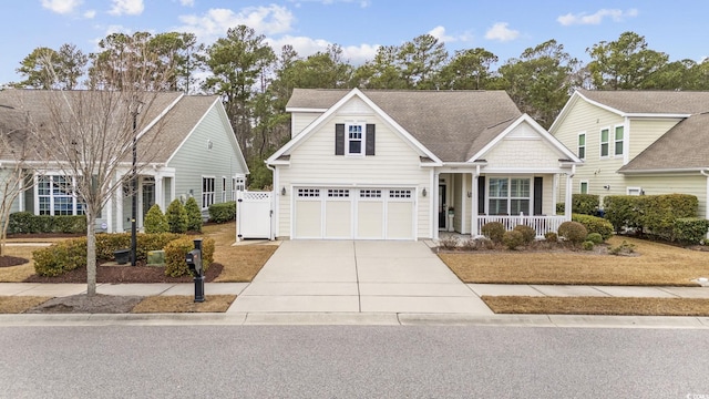 view of front of property with a garage and a porch