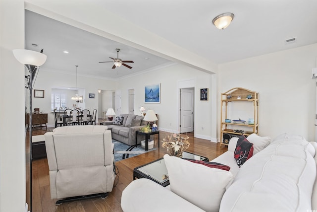 living room featuring crown molding, ceiling fan, and hardwood / wood-style floors