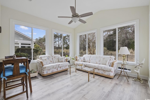 sunroom with vaulted ceiling and ceiling fan