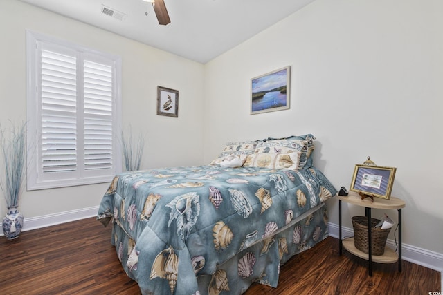 bedroom with dark wood-type flooring and ceiling fan