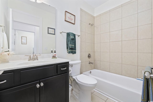 full bathroom featuring tiled shower / bath combo, vanity, tile patterned floors, and toilet