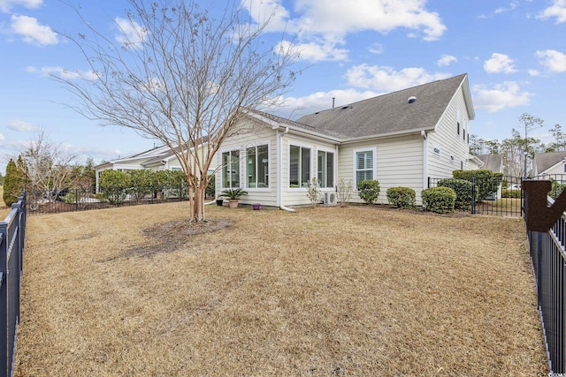 back of house featuring a yard