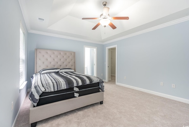 carpeted bedroom with crown molding and ceiling fan