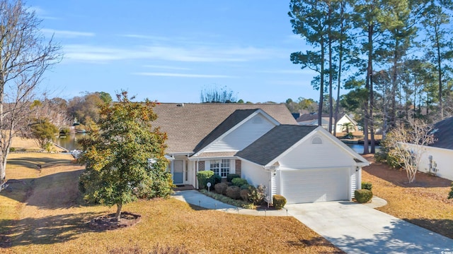 view of front of home with a garage and a water view