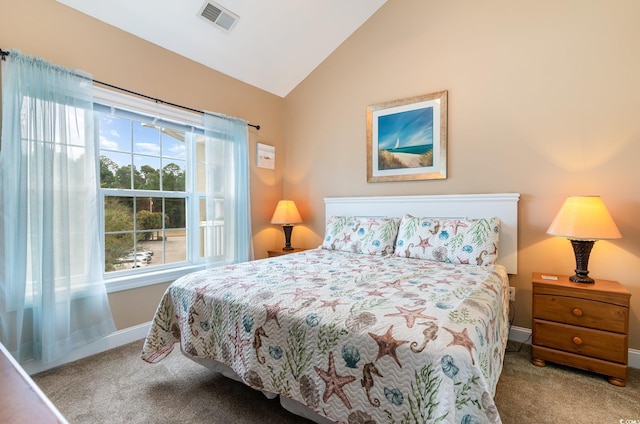 bedroom with lofted ceiling, carpet flooring, visible vents, and baseboards