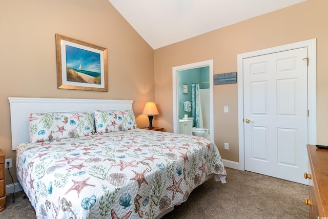 bedroom with lofted ceiling, carpet, and ensuite bathroom