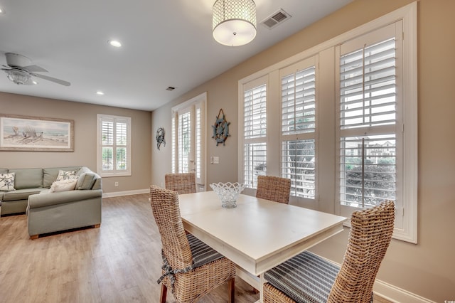 dining area featuring ceiling fan and light hardwood / wood-style floors