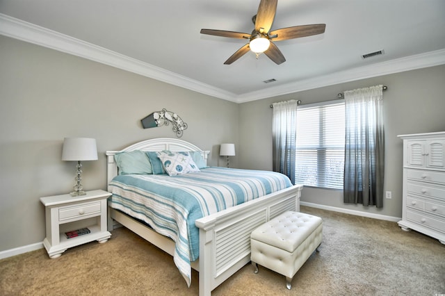 bedroom with ornamental molding, light colored carpet, and ceiling fan