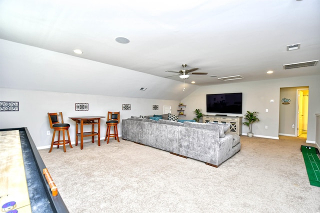 living room featuring vaulted ceiling, light colored carpet, and ceiling fan