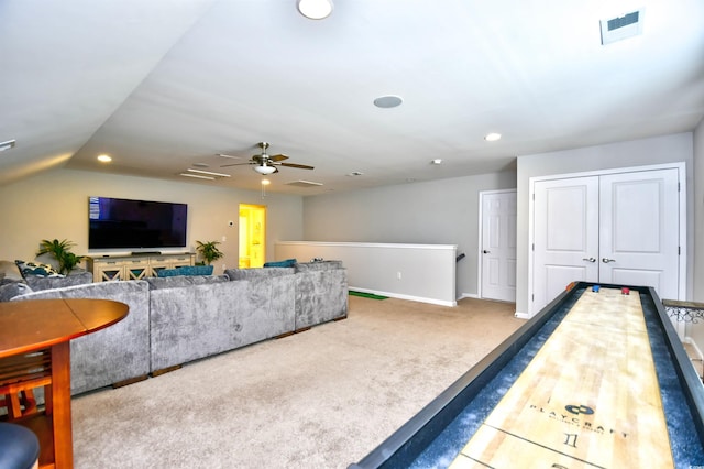 recreation room with ceiling fan, lofted ceiling, and carpet