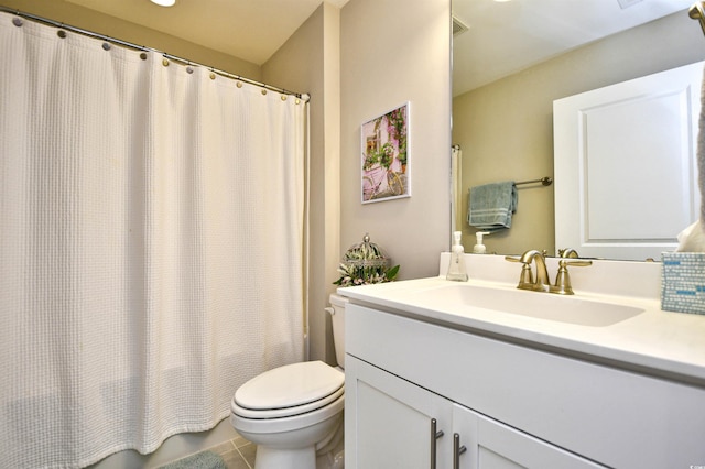 bathroom with vanity, tile patterned floors, and toilet