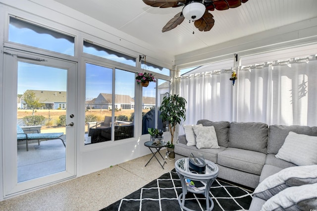 sunroom with a wealth of natural light and ceiling fan