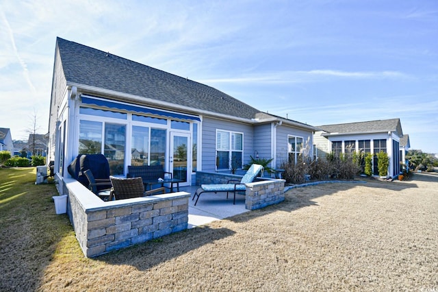 rear view of property with a patio area