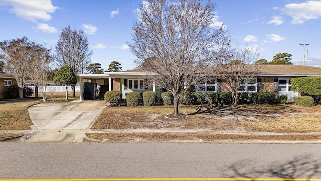 ranch-style home with a carport