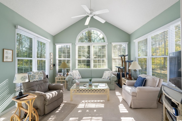 sunroom / solarium with ceiling fan and lofted ceiling