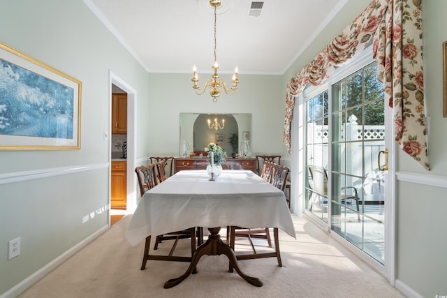 carpeted dining area featuring crown molding and a notable chandelier