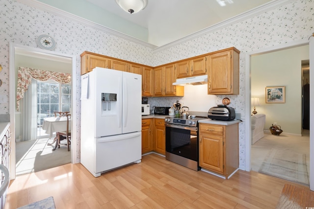 kitchen featuring light wood-type flooring, ornamental molding, and white appliances