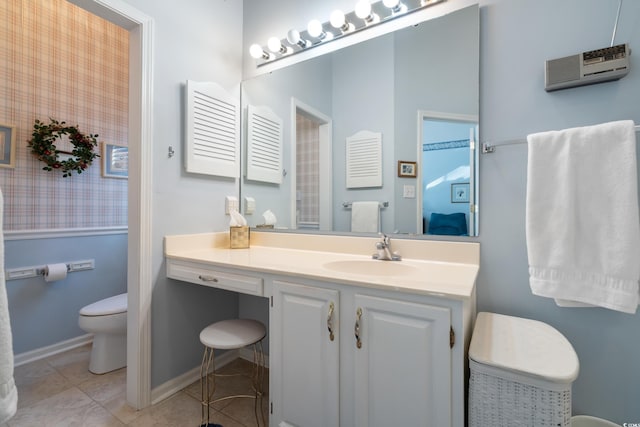 bathroom with tile patterned floors, toilet, and vanity