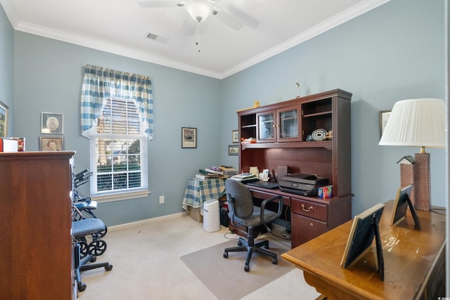 carpeted home office with ceiling fan and crown molding