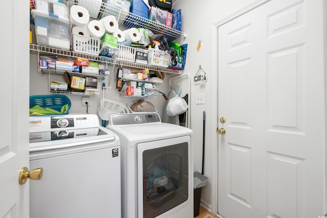 washroom featuring independent washer and dryer