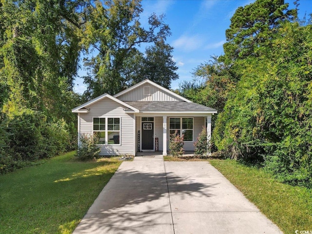 bungalow-style home with a front lawn