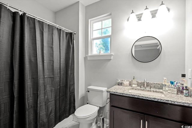 bathroom with toilet and vanity