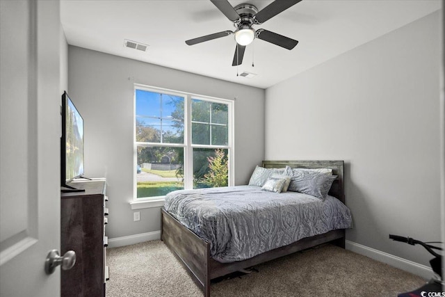 bedroom with ceiling fan and light colored carpet